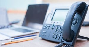 photo of an office telephone on a desk